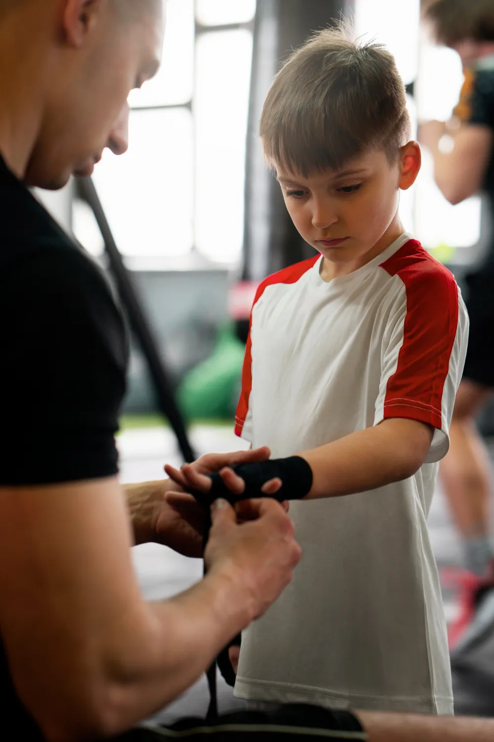 Side view boy training at gym<br />