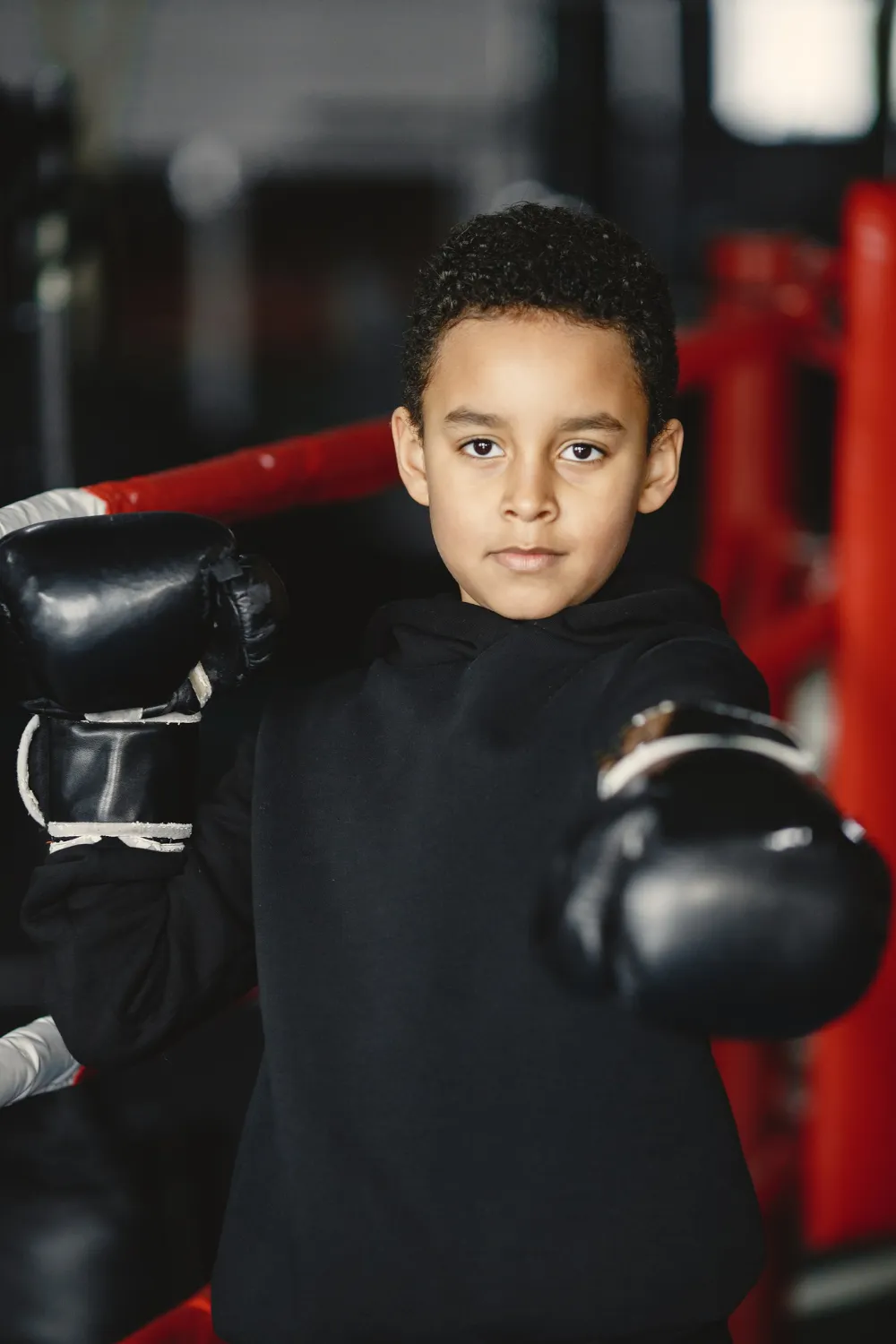 Young hardworking boxer learning to box. child at sport center. kid taking up a new hobby<br />