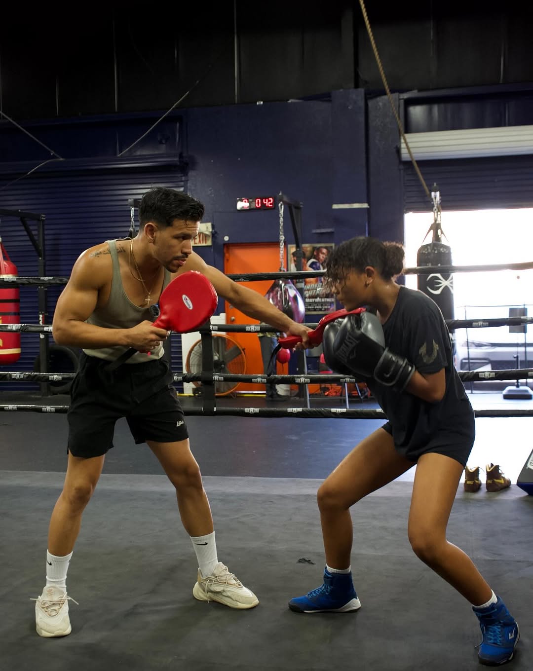 Side view boy training at gym<br />