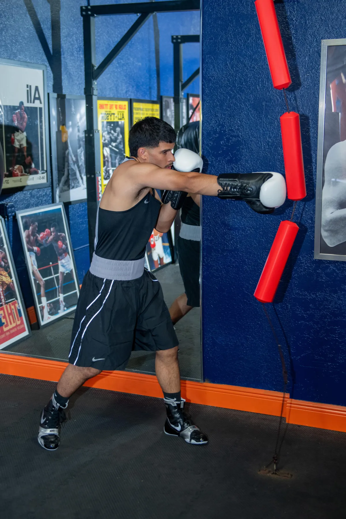 Side view boy training at gym<br />